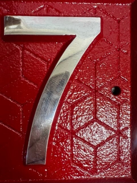 close up of Door number pattern in red
