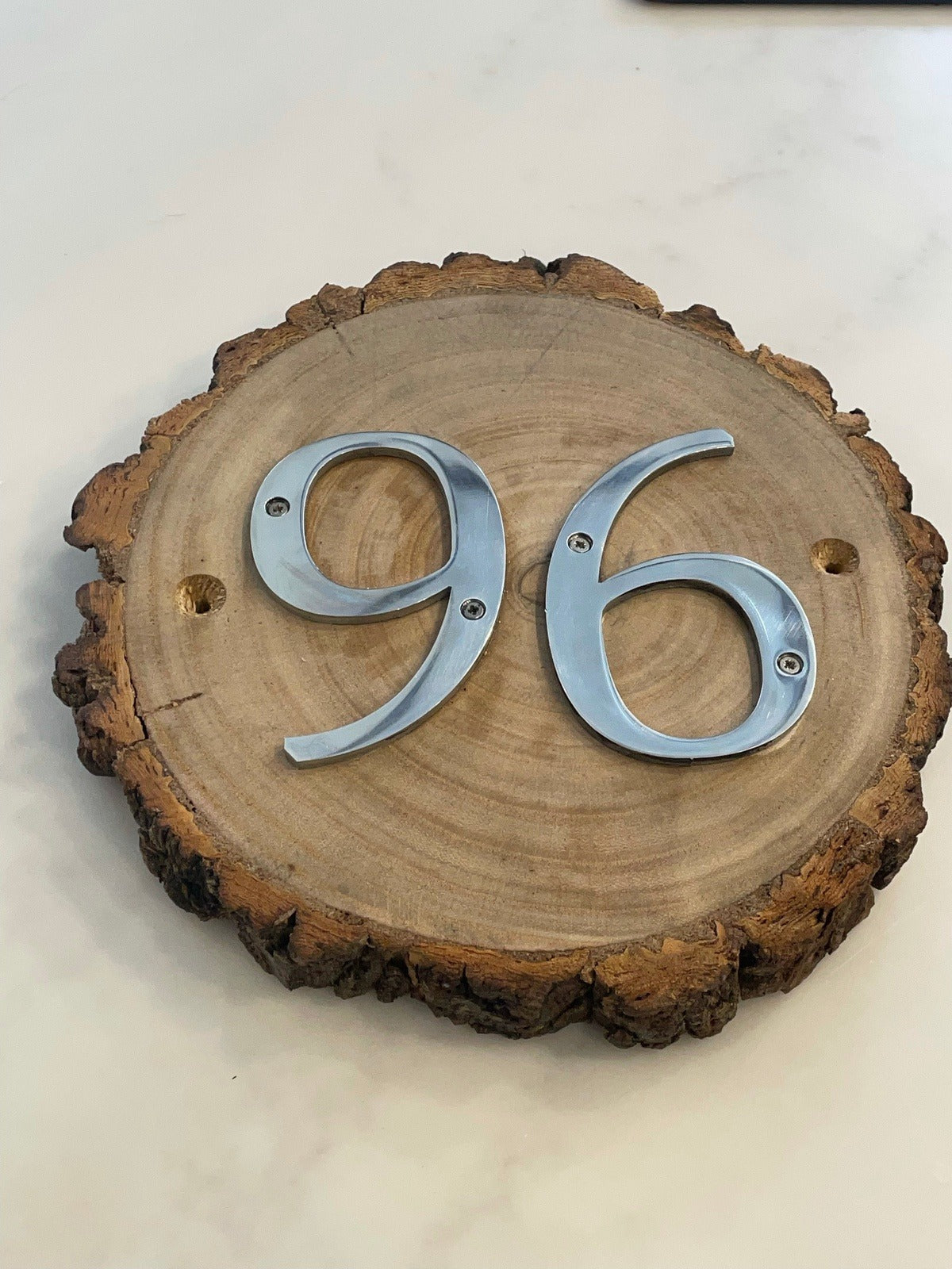 Metal House Numbers on Wood Log