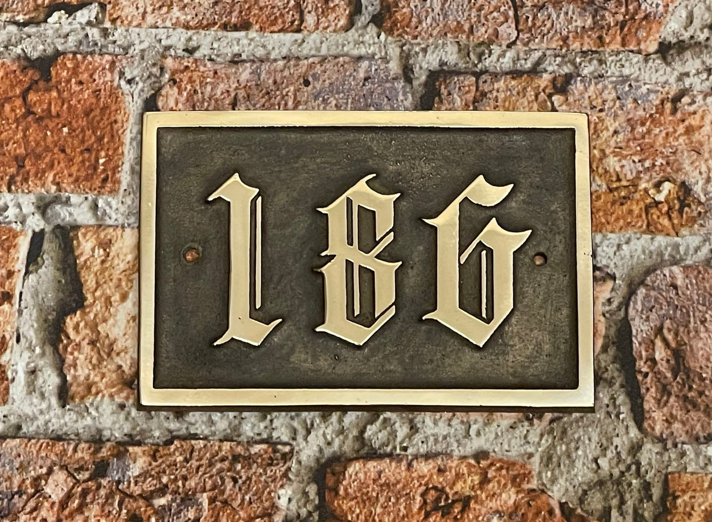 Traditional house sign old English font