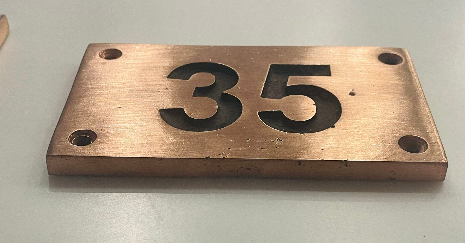 house number sign in copper